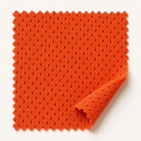 Burnt-orange eyelet mesh for high-airflow sportswear zones