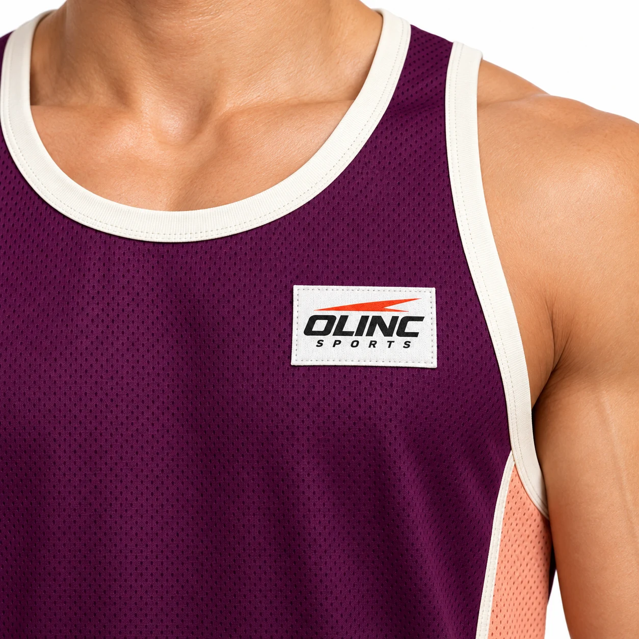 Basketball Arcstep Racerback Set zoom design view showing deep-plum body, pale-peach curved side sections and ivory binding