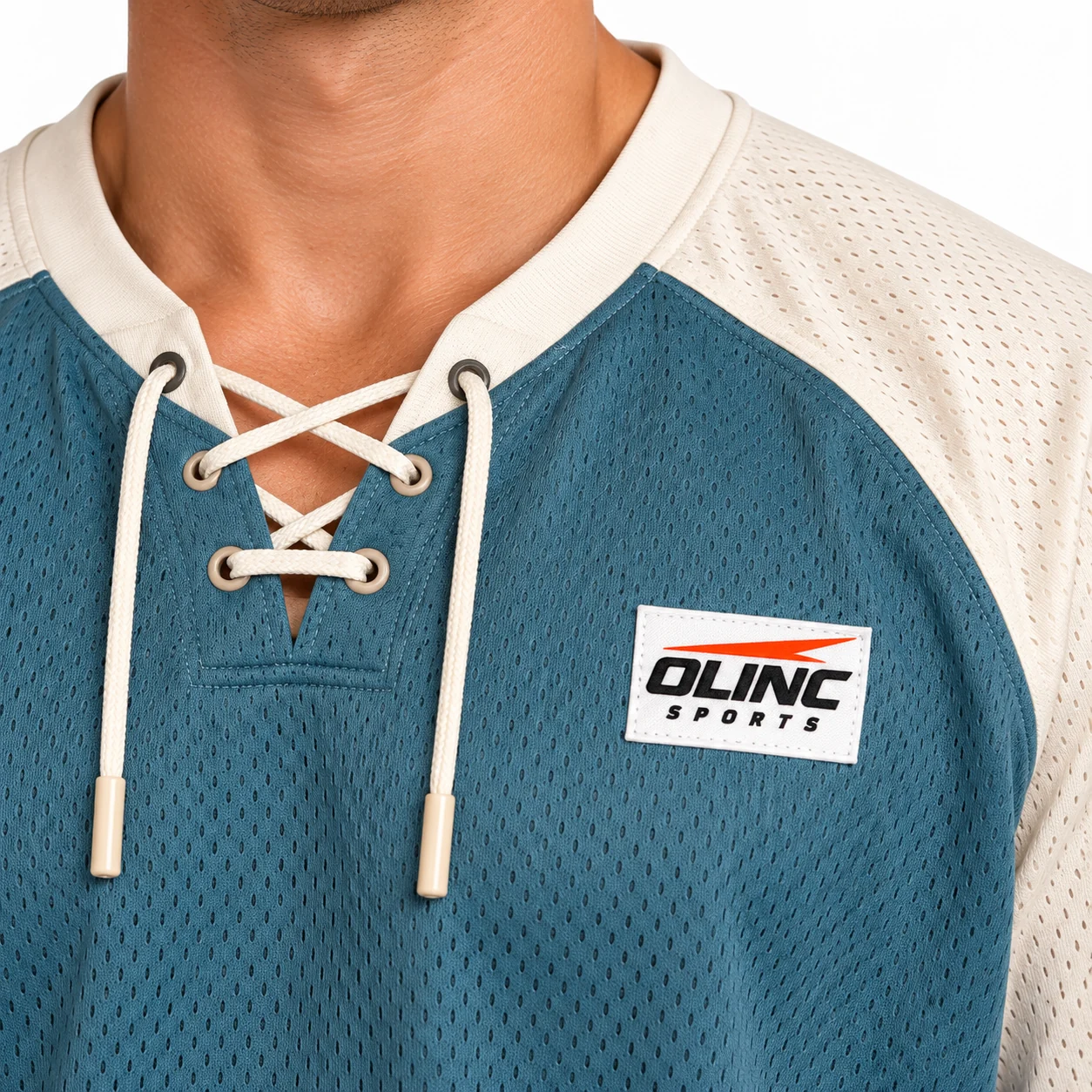 Lacrosse Breakwater Lace-Neck Jersey zoom design view showing dusty-teal body, bone shoulder yoke and ink-blue rectangular lower panels