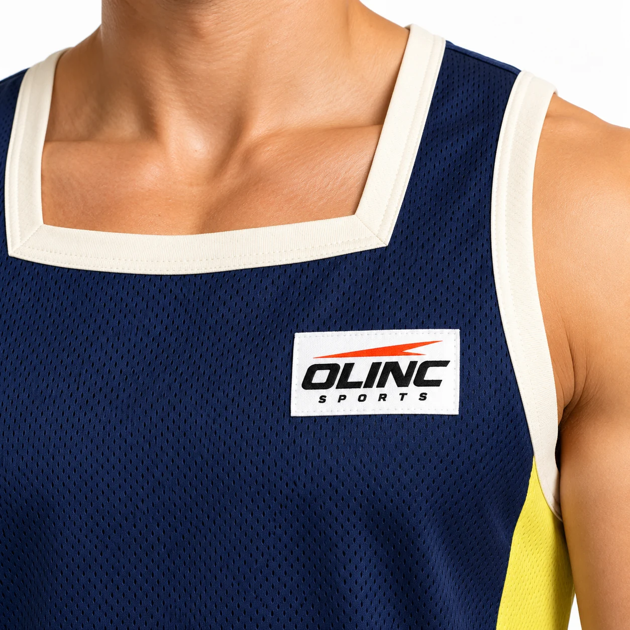 Basketball Quay Pocket Training Set zoom design view showing ink-navy jersey and shorts, lemongrass side blocks and ivory square-neck binding
