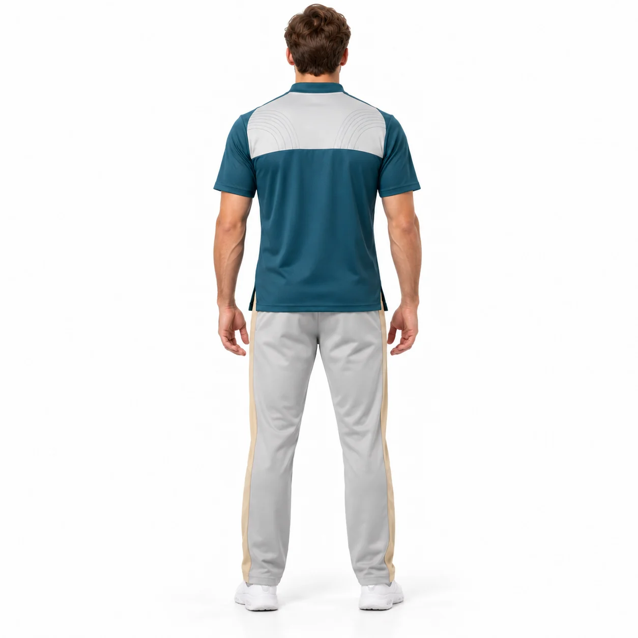 Cricket Fieldnote Zip-Neck Kit back design view showing deep-teal short-sleeve shirt, pale-gray chest yoke and sand trouser side panels