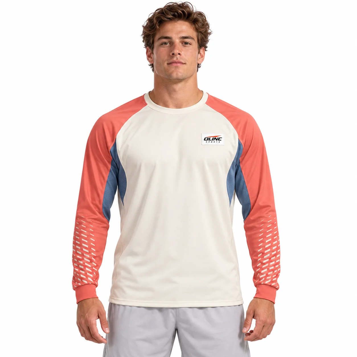 Lacrosse Stratum Long-Sleeve Top front design view showing cream body, muted-coral raglan sleeves and cadet-blue curved underarm inserts