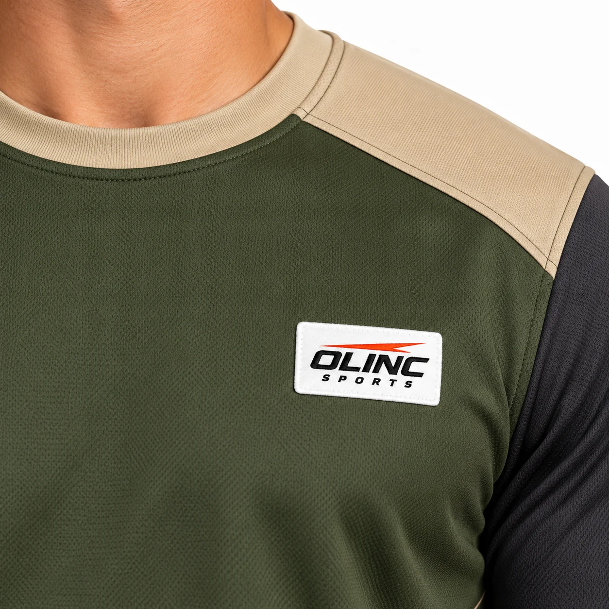 Rugby Arcfoil Crew Panel Jersey zoom design view showing dark-olive torso, sand saddle-shaped upper yoke and charcoal elbow-length sleeve ends