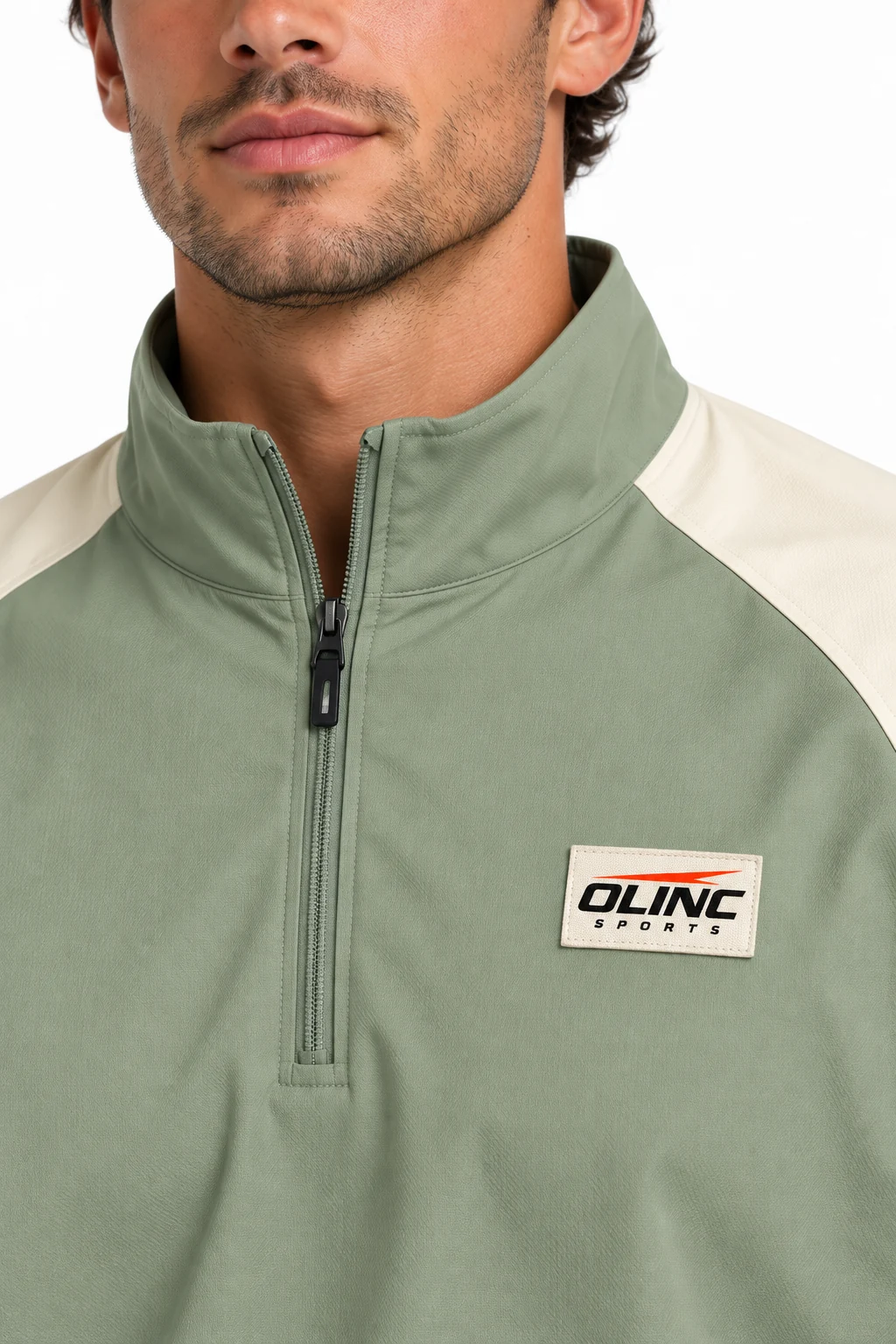 Baseball Bullpen Half-Zip Top zoom design visualization showing soft sage body, cream upper sleeves and deep navy lower sleeves