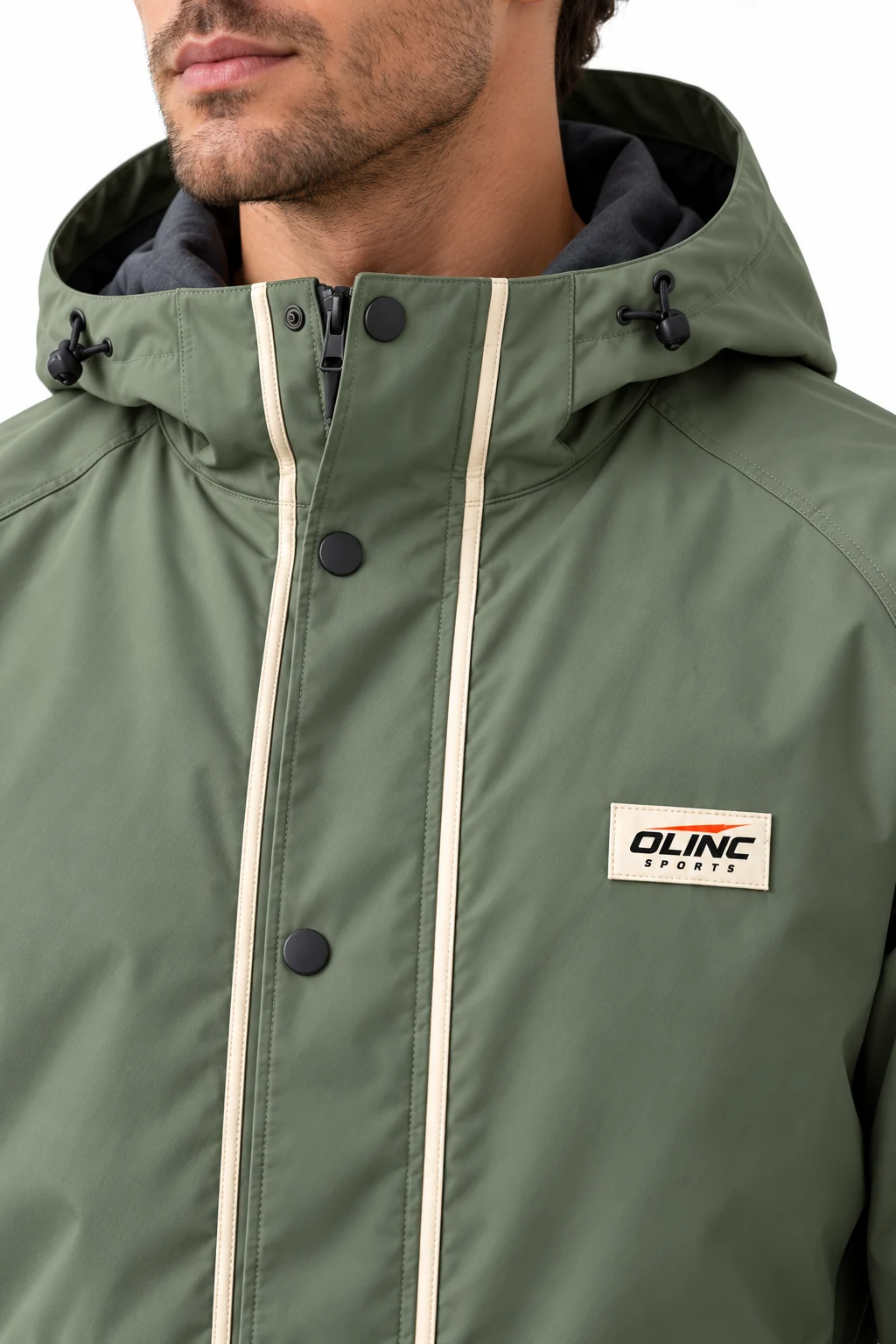 Jacket Marshline Long Shell zoom design visualization showing muted reed green body, charcoal hood lining and cream vertical piping accents