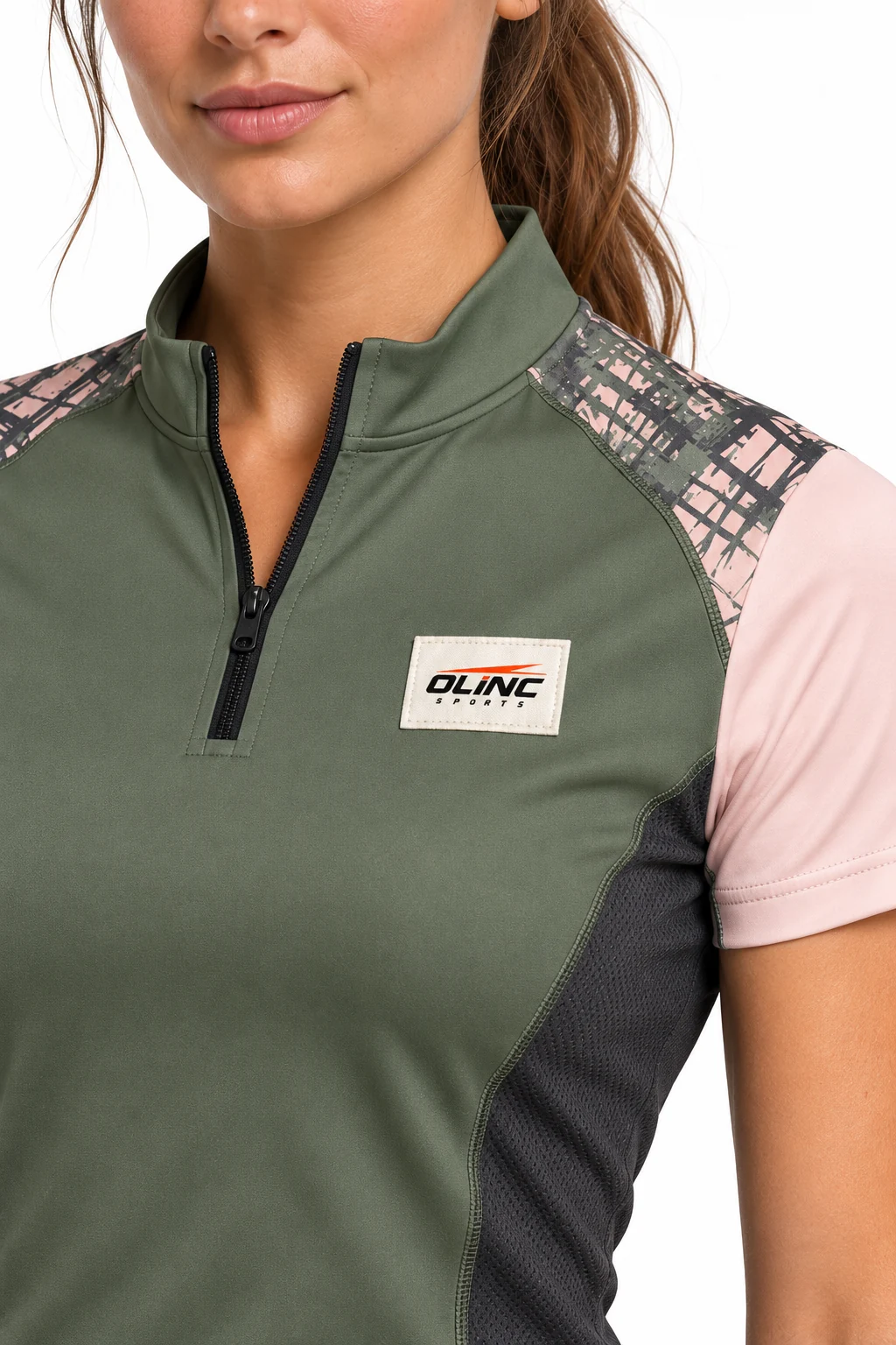 Lacrosse Halcyon Zip Shooting Top zoom design visualization showing muted moss body, pale blush sleeves and charcoal waist panels