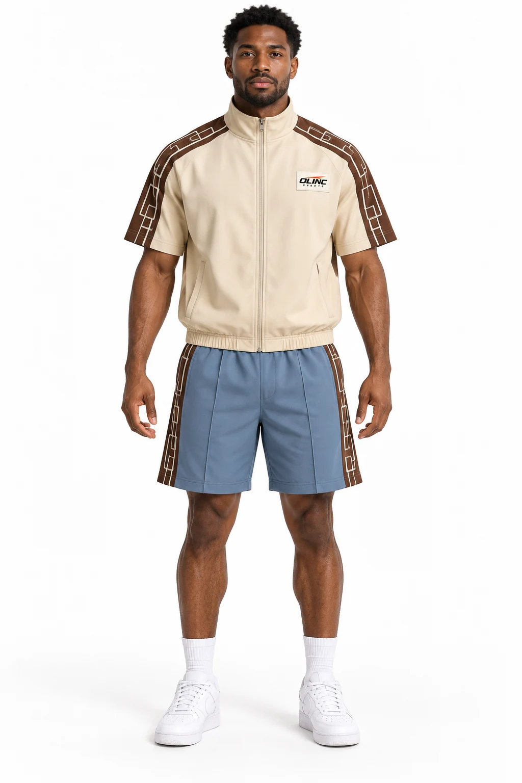 Tracksuit Overpass Short Set front design visualization showing pale sand top, deep umber shoulder panels and dusty blue shorts
