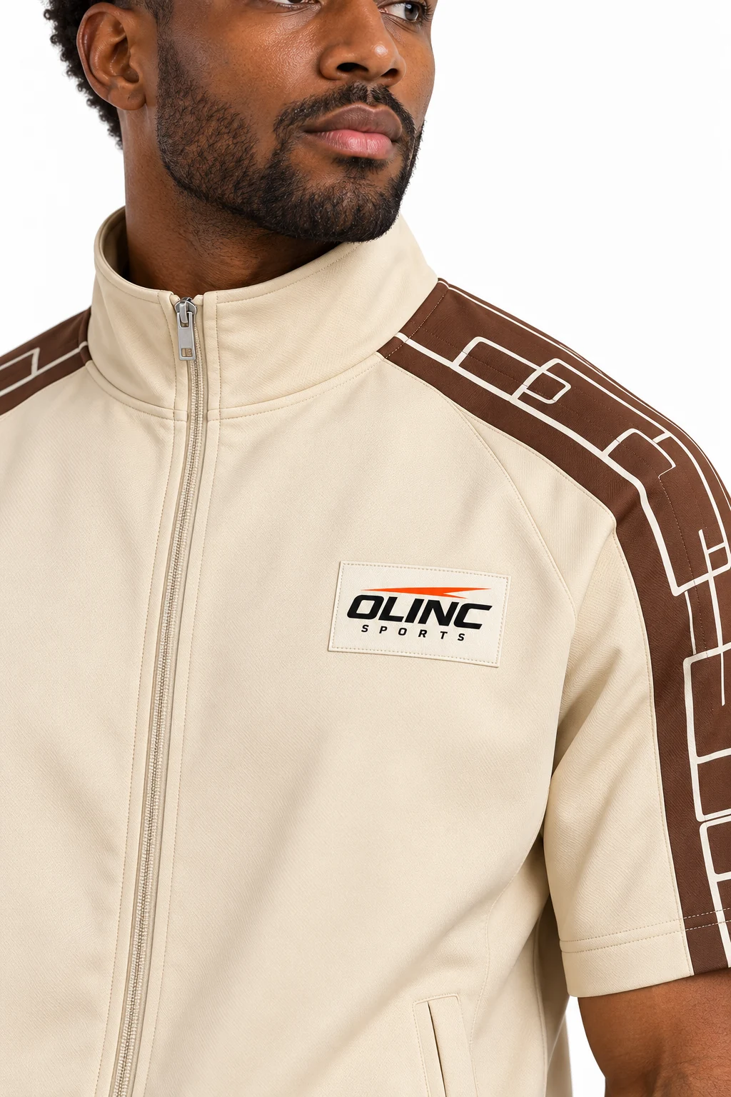 Tracksuit Overpass Short Set zoom design visualization showing pale sand top, deep umber shoulder panels and dusty blue shorts