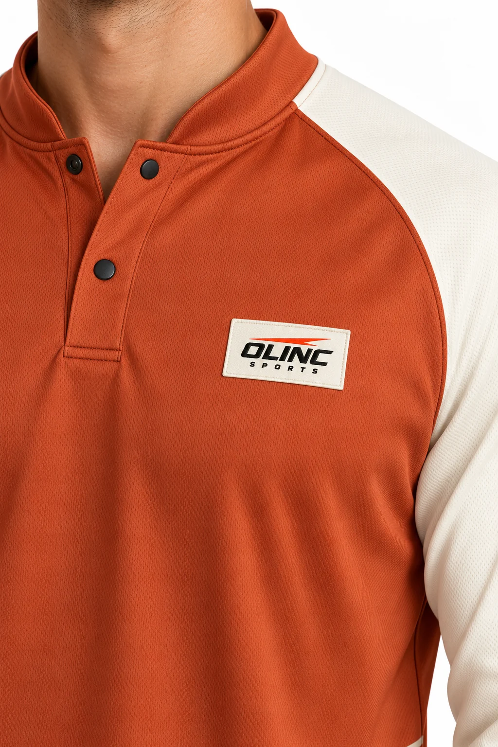 Handball Switchcourt Snap Warmup zoom design visualization of rust top, cream three-quarter sleeves and charcoal shorts
