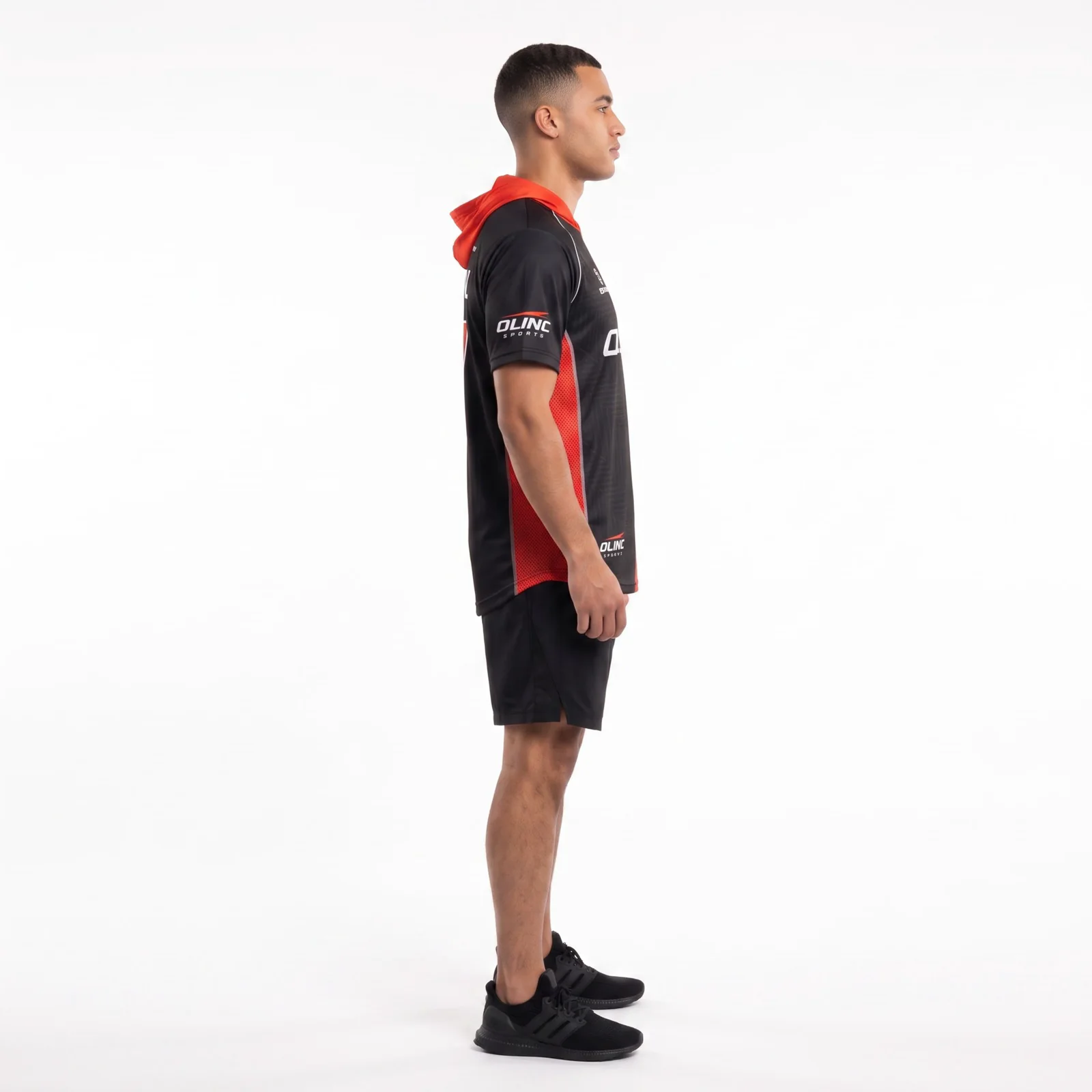 Side view of the black and red esports jersey showing the mesh side panel and elongated hem