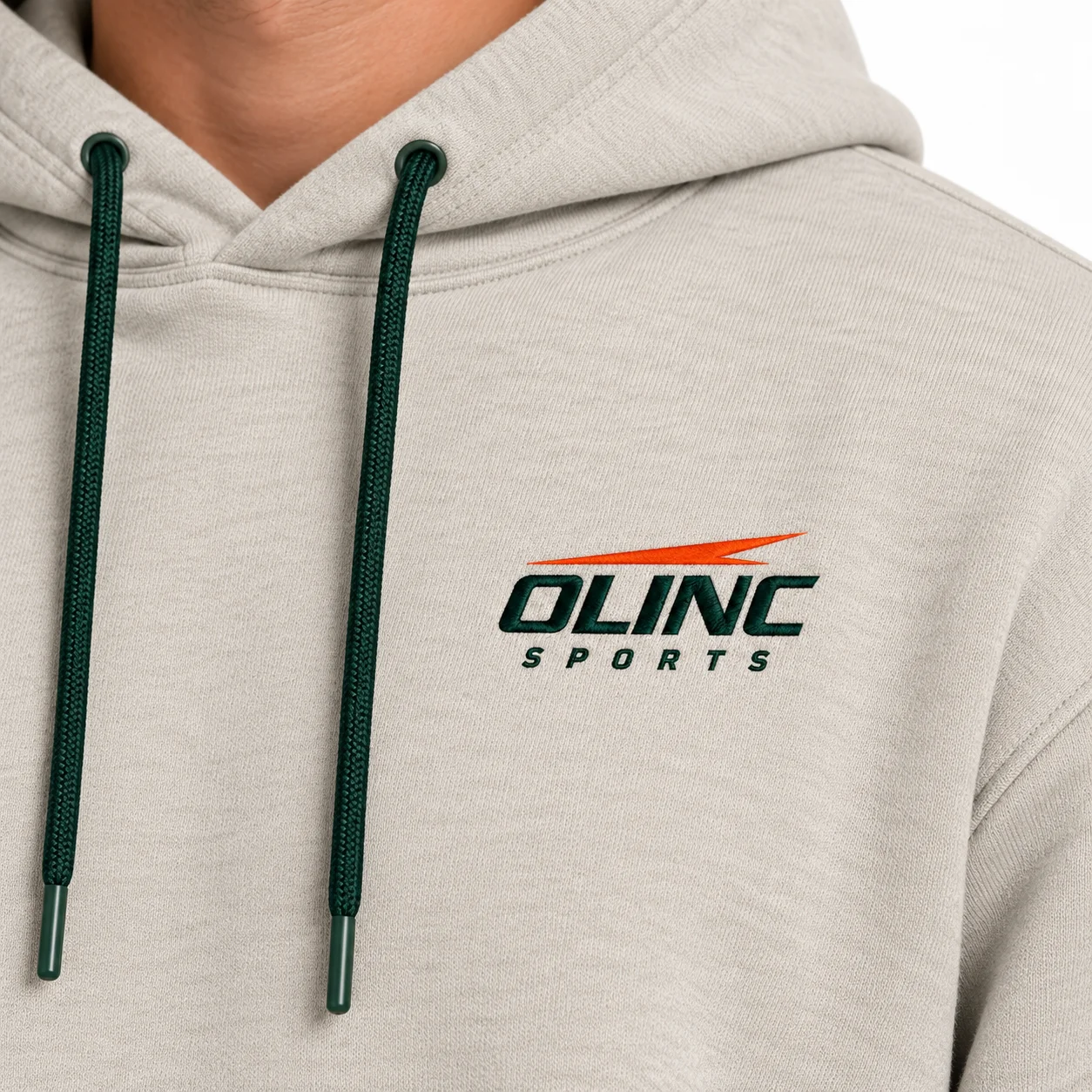 Clubhouse Fleece Hoodie zoom design view showing stone body, dark-green chest embroidery and matching drawcord